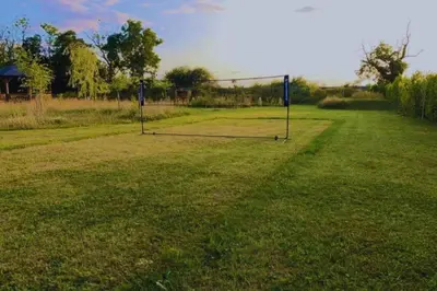a field with two goal nets in the grass at Bears House in Westley Waterless