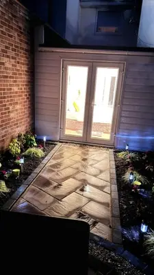 a patio with two windows and a brick building at Peaceful Springfield Studio in Chelmsford
