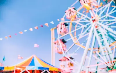 a carnival with a ferris wheel and tents at Cosy 8 Berth Caravan With Decking And Lake-Views At Weeley Bridge Ref 69001Lv in Clacton-on-Sea
