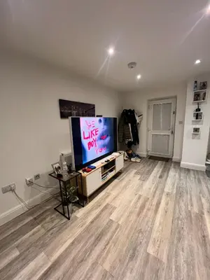 an empty living room with a flat screen tv at One bed flat in Sunny Southend! in Southend