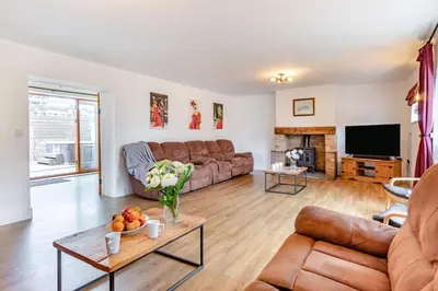 a living room with a couch and a table at 6 Bed in Three Holes oc-t31855 in Upwell