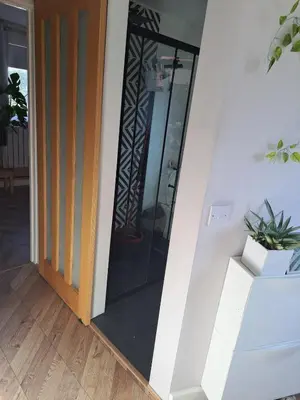 a glass door of a house with a plant at Whole Annexe in our family home & private entrance in Ipswich