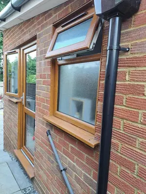 a window on the side of a brick building at Whole Annexe in our family home & private entrance in Ipswich