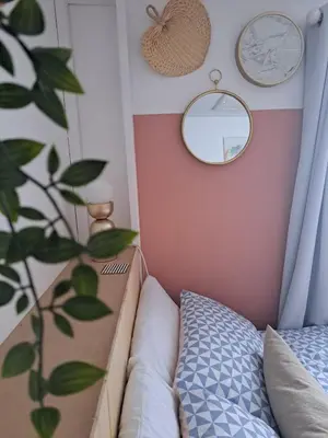 a bedroom with a bed and mirrors and a plant at Whole Annexe in our family home & private entrance in Ipswich