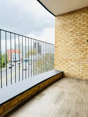 a balcony with a view of a street at Gorgeous two bedroom luxury Apartment sleeps 6 in Brentwood