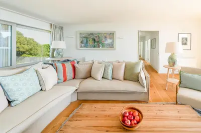 a living room with a couch and a table at Heath House 8 in Thorpeness