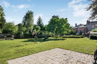 a park with a playground in the grass at 6 Bedroom - Luxury - Cinema Room in Hertford