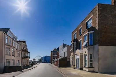 an empty street in a city with buildings at Blue Horizon Seaside Apart in Clacton-on-Sea