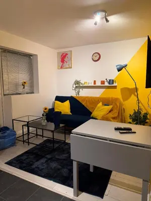 a living room with a couch and a table at 3 Bed Home, Sleeps 7 with Garden in Basildon in Basildon