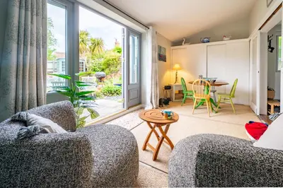 a living room with a couch and a table at Sanderlings 4 in Aldeburgh
