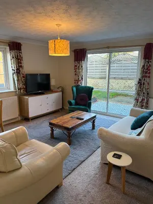 a living room with a couch and a coffee table at The Wright Place To stay in East Harling