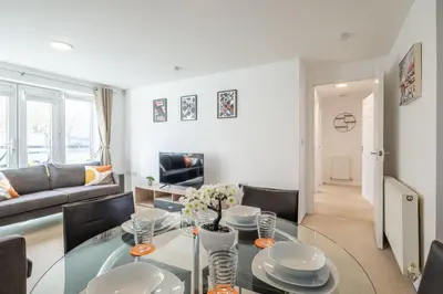 a living room with a glass table and chairs at Spacious 2BR I 2BA I Sleeps 4 I Near Science Park in Milton