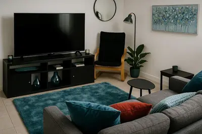 a living room with a television and a couch at The Little Nest in Colchester in Colchester