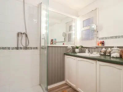 a bathroom with a shower and a sink at Berkley Cottage in Colchester