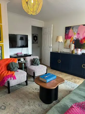 a living room with a couch and a table at Stylish One Bedroom Apartment in Central Potton in Potton
