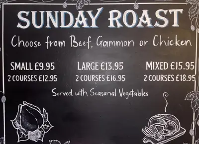 a chalkboard with a sign for a sunday roast at Brandon House in Brandon