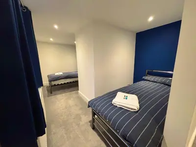 a bedroom with a bed with a white towel on it at Brandon House in Brandon