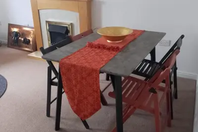 a table with a bowl on top of it at 2 Bed - Sleeps 4 - Free Parking in Ely