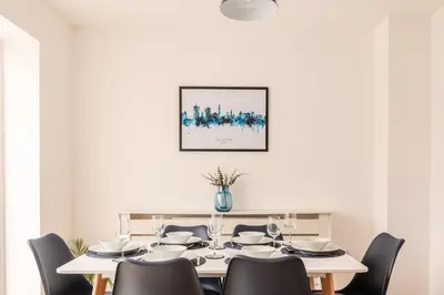 a white dining room with a table and chairs at 4 Bed, 3 Bath Townhouse in Colchester - Business, Contractor and Leisure - Singles or Superkings - Disc0unts in Lexden