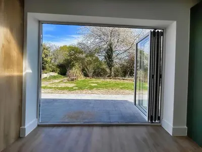 an open door with a view of a yard at Green Rig