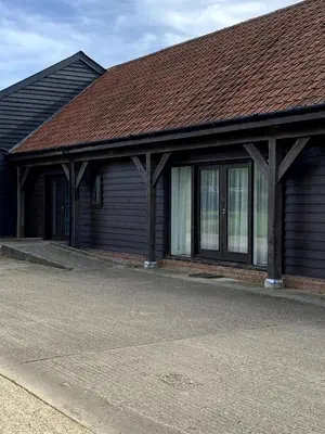 a building with a brown roof and windows at Entire flat 2 to 4 pers 1 bed 1 bath disabled access for limited disability