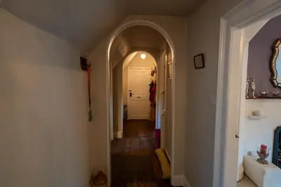 an open hallway with an archway in a home at The Old Rectory Framlingham in Framlingham