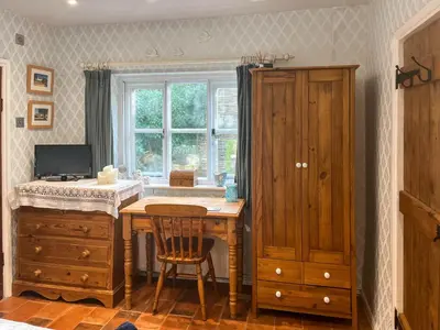 a room with a desk and a window at Hill House in Colchester
