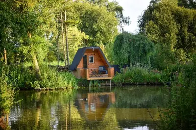 a cabin in the middle of a river at Rum Bridge Glamping and Fishing Resort in Clare