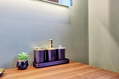 a couple of purple cylinders sitting on top of a table at Luxury Apartment- Beach 10mins in Thorpe Bay
