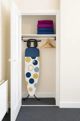 a surfboard is inside of a closet at 1 Bed Service Accommodation- contractor ready in Southend-on-Sea