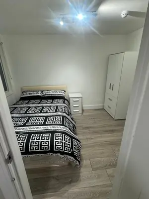 a bedroom with two beds in a room at Systematic Home in Battlesbridge