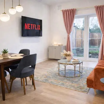 a living room with a table and a couch at Spacious 2BR Designer Home in Newmarket , Private Grounds & Garden in Newmarket