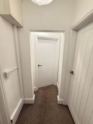 a hallway with a white door in a room at The Coral Stay By Cambridge Central Station in Cambridge