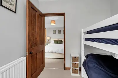 a bedroom with a bunk bed and a bunk bed at 10 Mustow St - Charming 3 bed home next to the Abbey Gardens in Bury St Edmunds in Bury Saint Edmunds