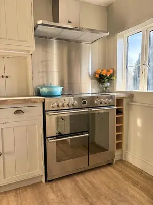 a kitchen with a stainless steel stove top oven at Beautiful Four Bedroom Cottage in Little Glemham, Suffolk in Little Glenham