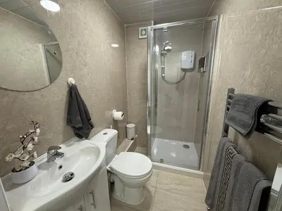a bathroom with a sink toilet and a shower at Large 5BR House with FREE Parking and WiFi plus Garden in Basildon, Essex in Basildon