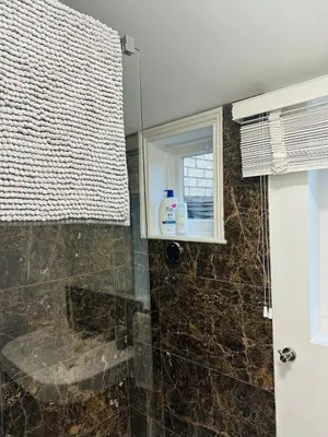 a bathroom with a shower with a window at Central Cambridge with Free Parking and Pets welcome in Chesterton