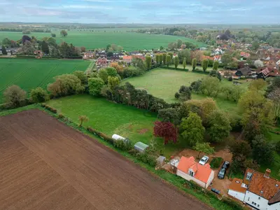 an aerial view of a farm with a field at Hare View, part of The Garden House in Kenninghall