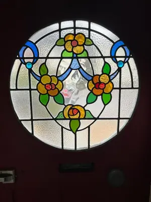 a stained glass window with flowers on a ceiling at 'The Artist's Loft' - Studio Flat in Cambridge in Cambridge