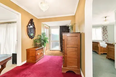 a living room with a dresser and a bedroom at 2-Bed Home with Free Parking - 2 min Walk to Bus in Cherry Hinton