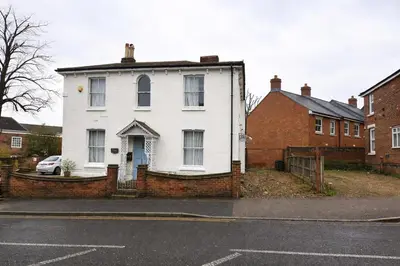a white house on the side of a street at landvue stays, The Colchester town White House 4 bed 2 bath! in Mundon