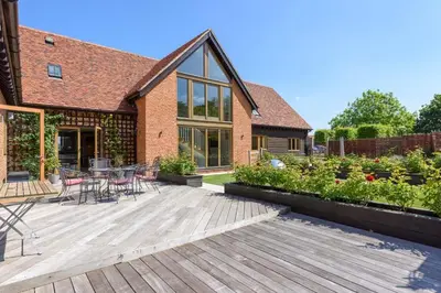 a wooden deck in front of a house at Fidlers Moat - Games Room, Gym, Hot Tub