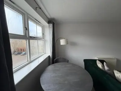 a small room with a table and a window at BMC Serene Spacious 1BR Flat in Enfield