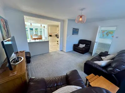 a living room with a couch and a chair at Detached, 4 Double Rooms, 2 En-Suites, 5 Car Parking in Lexden