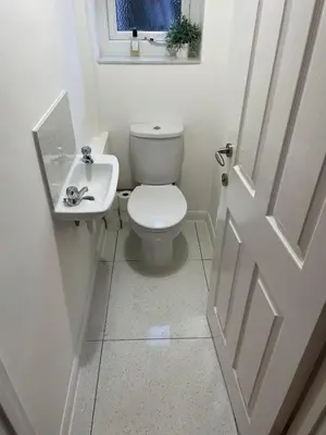 a white bathroom with a toilet and a sink at Detached, 4 Double Rooms, 2 En-Suites, 5 Car Parking in Lexden