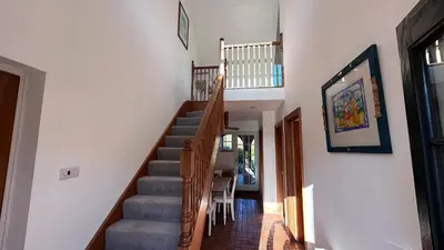 a staircase in a house with a stair case at The Coach House WPH, Epping in Epping
