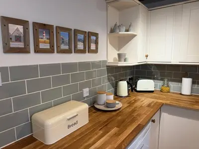 a kitchen with a counter top with a coffee maker at Pretty Cottage in Harleston, Norfolk, dog friendly in Harleston