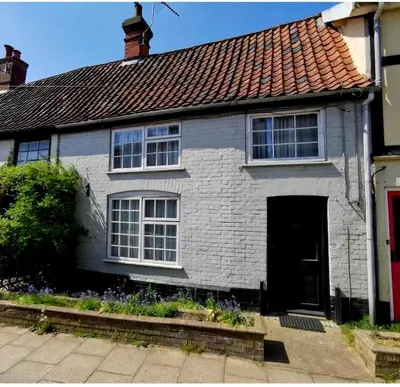 a white brick house with a red roof at Pretty Cottage in Harleston, Norfolk, dog friendly in Harleston