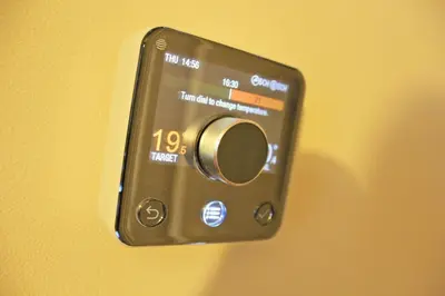 a close up of a digital clock on a wall at Central 3 BR Home with Private Courtyard in Ely