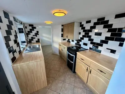 a kitchen with a sink and a stove at Spacious 3 bedroom house in Central Leiston in Leiston